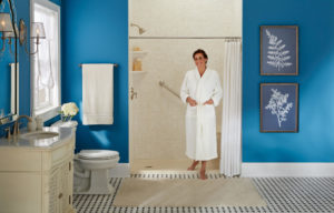 A newly installed walk-in shower and a satisfied homeowner
